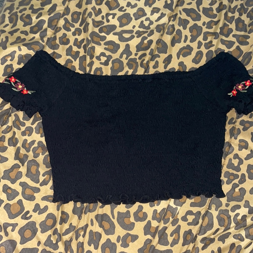 black crop top with flowers on sleeves